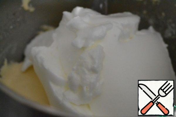 Mix flour and baking powder for the dough.
Reduce the speed of the mixer to a minimum. Add flour.
Add the whipped whites and, already with a spatula, gently mix the whites into the dough.
