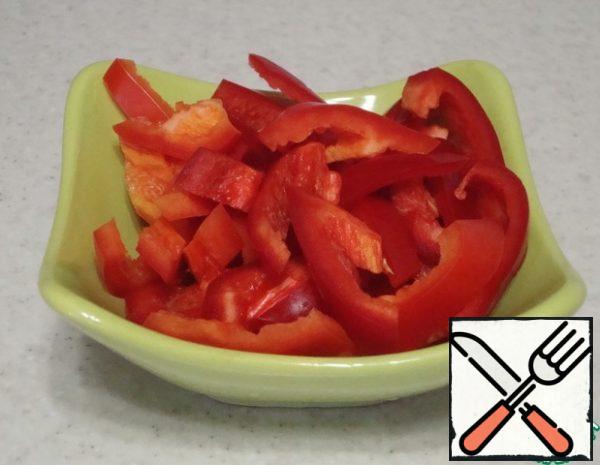 Peel the bell peppers and cut into strips.