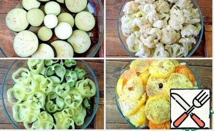 In a baking dish put the first layer of eggplant, then pepper rings, spread out cauliflower. Tomatoes cut into circles and lay on cabbage the final layer by layer. Pour vegetable oil, salt, flavor seasoning.