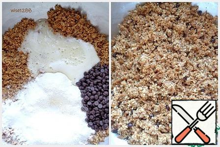 To peanuts add flour, baking powder, baking soda, chocolate drops, egg mixture. Stir. The dough will turn out grains.