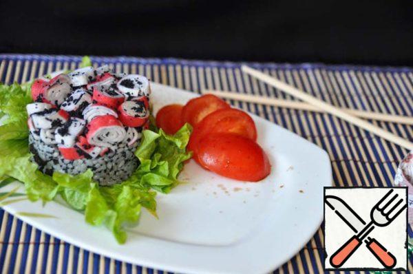 Spread on top of rice crab sticks, lightly press. Remove the ring. Decorate the salad with sliced tomatoes, sprinkle with balsamic sauce.