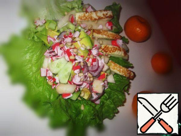 On leaf salad or on plate posting all ingredients, sprinkle pine nuts and drizzle dressing.