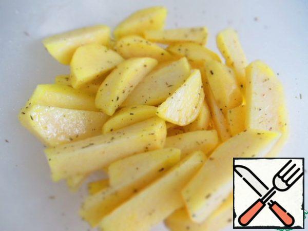 Put it in a bowl, add 1 tsp. starch, spices to taste, mix, add 2-3 tbsp.l. vegetable oil, mix again, put on a baking sheet covered with paper.
