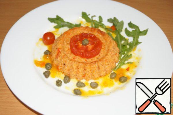 Grease a portion plate with sauce. Spread one cake, decorate with capers, arugula and cherry tomatoes.