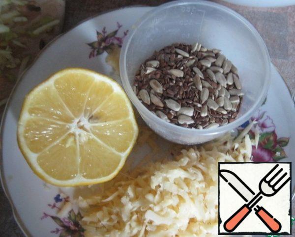 Grate cheese, mix with seeds,
squeeze lemon into the oil, add garlic, seeds.
