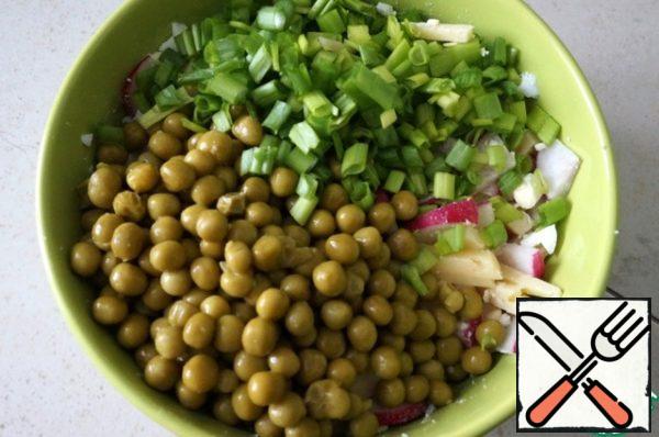 Add the green peas and finely chopped green onions.
