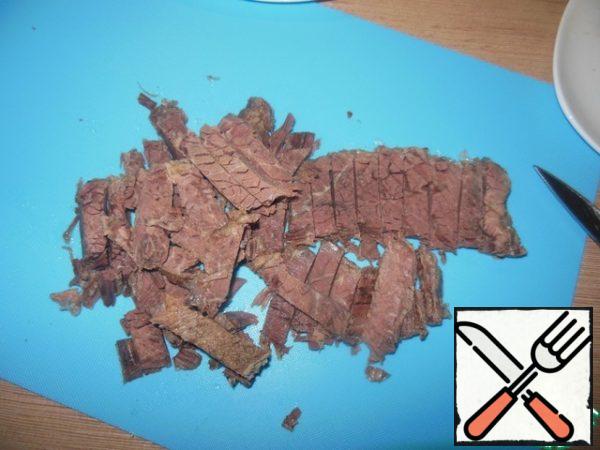 Beef cut into strips.