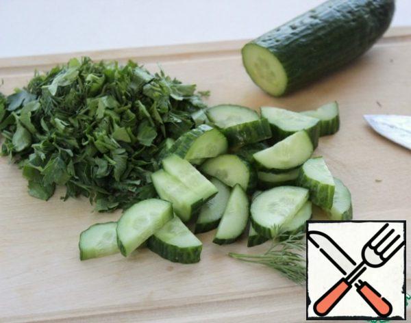 Greens, fresh cucumbers wash, dry, cut.
