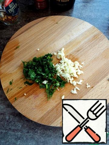 Garlic and herbs are minced.