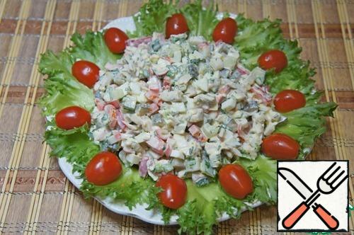 Put on a dish covered with lettuce and garnish with halves of cherry tomatoes.