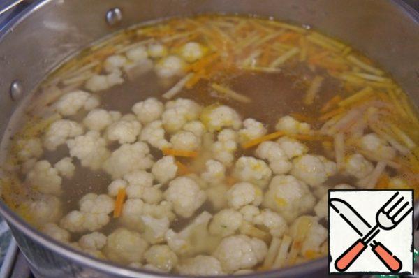 Add the cauliflower, bring to a boil again, cook for 5 minutes.
