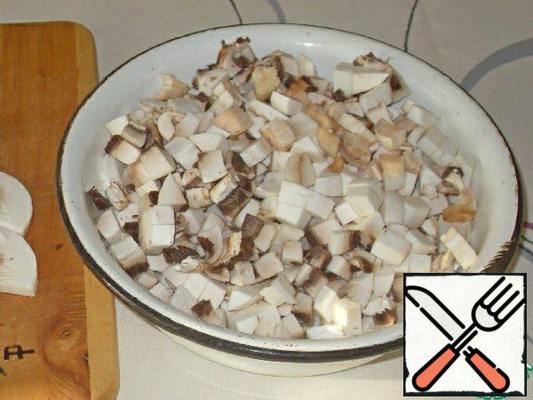 Onions cut very finely, mushrooms-small cubes.