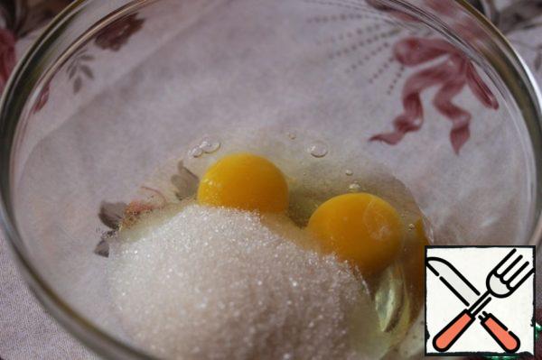 Beat eggs with sugar until fluffy light weight.