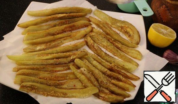 Fry in vegetable oil on each side until cooked and spread on paper towels to absorb excess fat.
