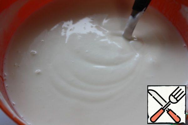 Mix yogurt with flour and egg.
You can take yogurt instead of yogurt and sour cream in equal proportions.