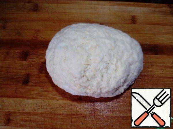 Add flour gradually and knead the dough (flour can go a little more or a little less depending on the flour). The dough should not get tight, but should stick to your hands a little.