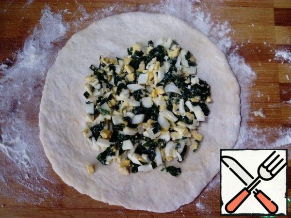 Using your hands, form a tortilla and spread with two tablespoons of filling.
