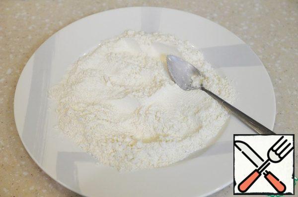 In a bowl, mix the flour with the remaining salt.
