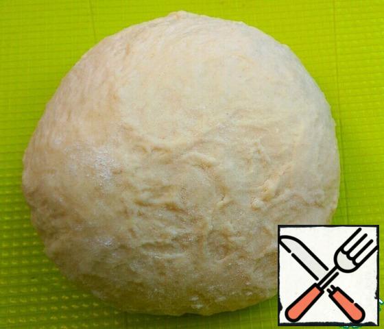 Add the flour. Knead a little sticky dough.
Leave in a warm place for 30 minutes. Then knead the dough well. Leave for another 20 minutes.