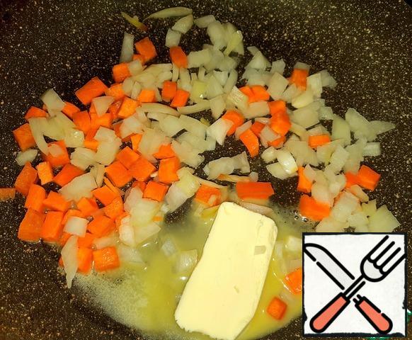 While the vegetables are cooking, finely chop the onions and carrots. Add the butter to the pan.