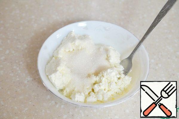 In cottage cheese add sugar.