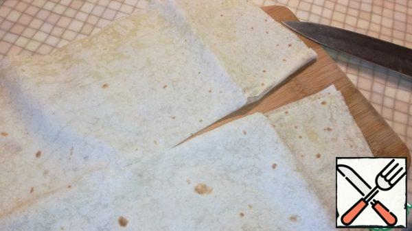 Cut two thin sheets of lavash lengthwise.
