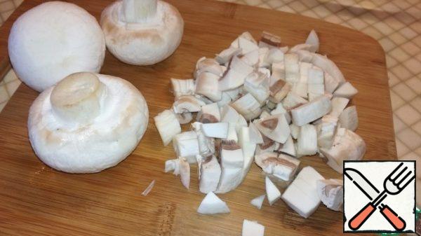 Mushrooms and onions cut into cubes.
