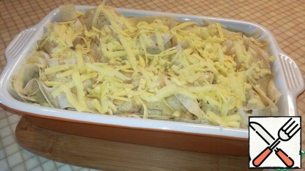 Pour over the remaining egg mixture and sprinkle with the remaining grated cheese.
