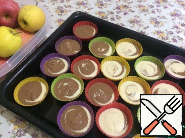 Now take a match or a toothpick and pour the dough into the molds.
