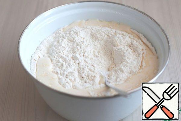 Add the total amount of flour (420 gr.). If, in your opinion, the dough will be slightly liquid, you can add a little more flour. The dough should be soft and plastic, convenient in rolling into the formation.
