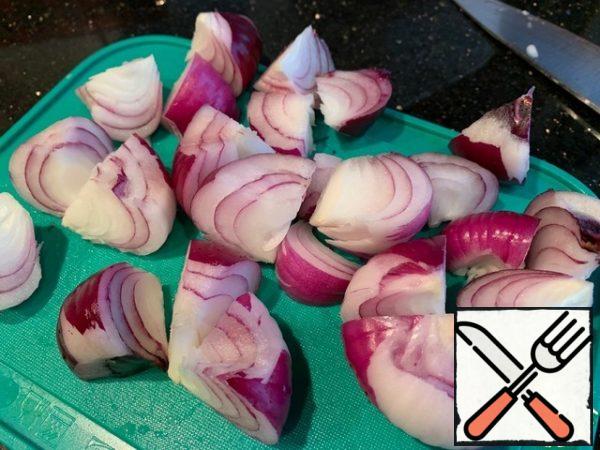 Red onion cut into quarters, and also fry, put in tagine.