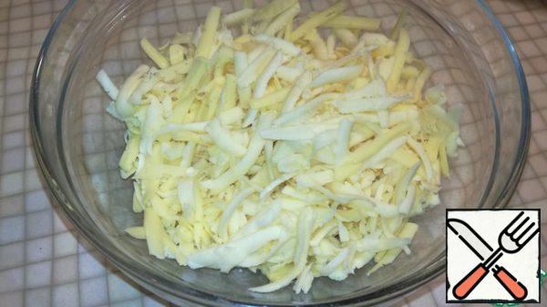 While the dough rests let's do the filling. All cheese three on a coarse grater. Stir.