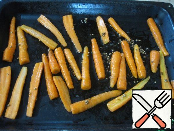 On a baking sheet put carrots with oil.