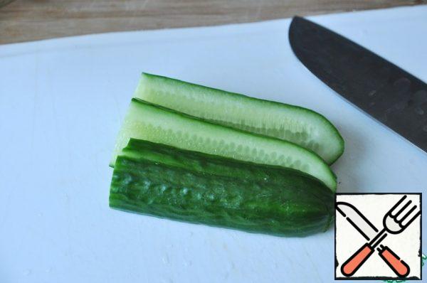 Cucumber cut along thin strips.