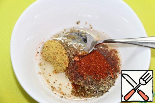 Mix all the spices, add mustard, oil, mix well.
