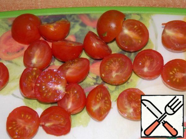 Cherry tomatoes cut in half.