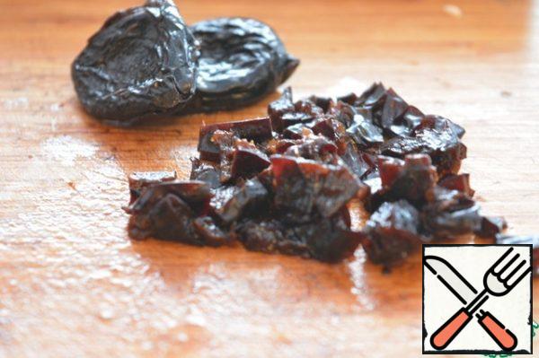 Pour boiling water over the prunes for 15 minutes, dry and finely chop.
