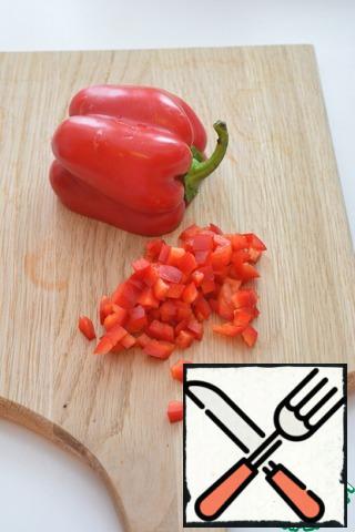 Dice the red bell pepper.