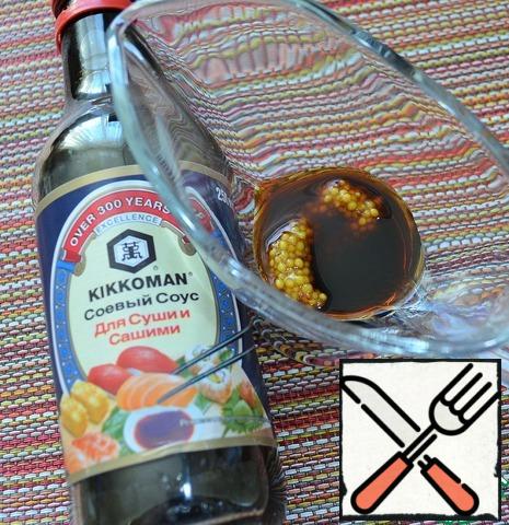 Soy sauce ( I use soy sauce for sushi) mustard and fragrant salad oil carefully beat with a fork until smooth emulsion.