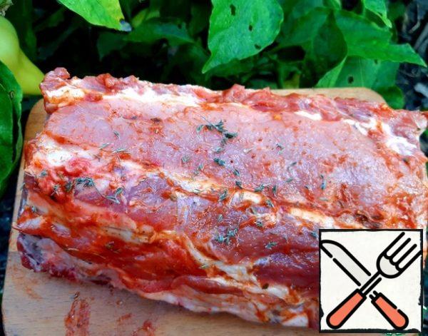 Grate the ribs with spices and adjika. Leave for 20 minutes and then send in a preheated 200 degree oven, in a sleeve or foil for 1 hour.