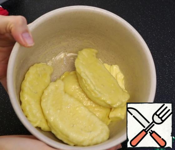 Transfer to a mold with plenty of butter. Do not regret, it is very tasty) and after each batch mix well.