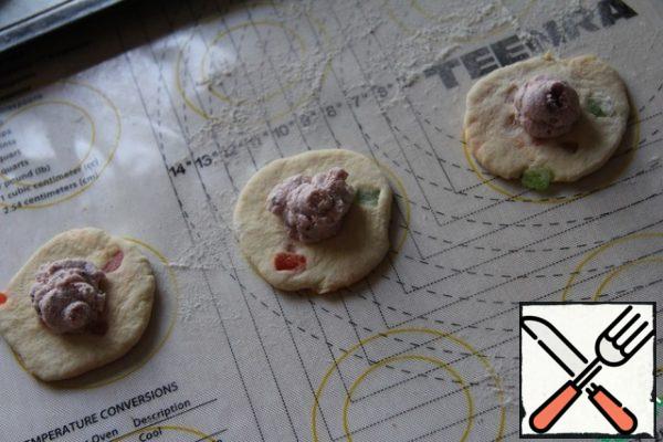 Roll out each ball of dough and lay out the filling.
