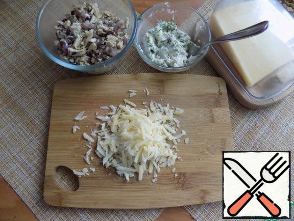 Grate the cheese. I'll use the Parmesan. We need cheese for baking.