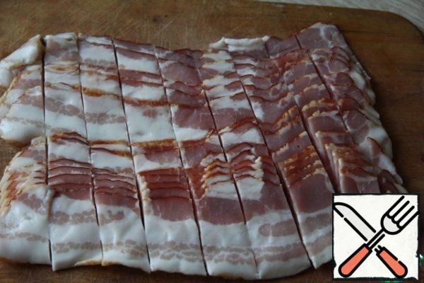 Bacon cut into pieces.