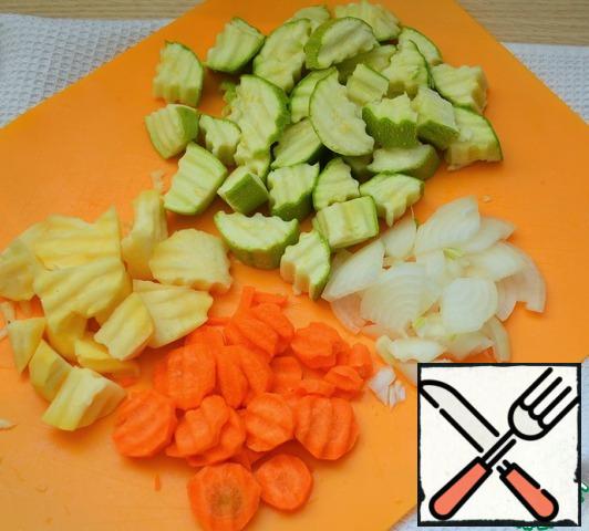 Vegetables and roots wash, peel and chop.