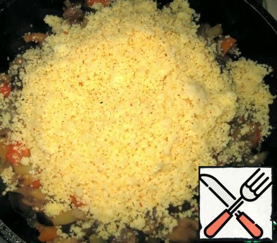 Add the couscous to the vegetables, mix well and remove from heat. Allow to cool slightly and serve.