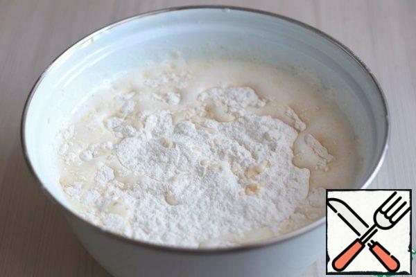 Then add flour (230 gr.). Beat the mixture well.
Leave the mixture for 1 hour. - 1 hour. 30 min.