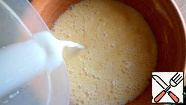 Pour in the milk. Whisk again.
