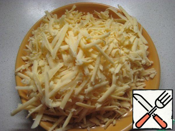 Grate cheese.