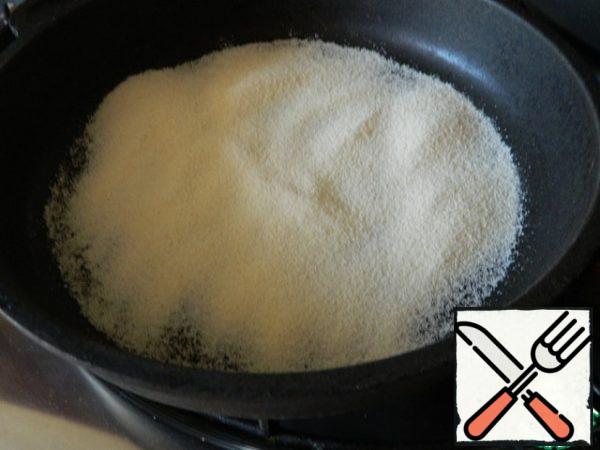 Heat semolina in a dry pan until creamy.